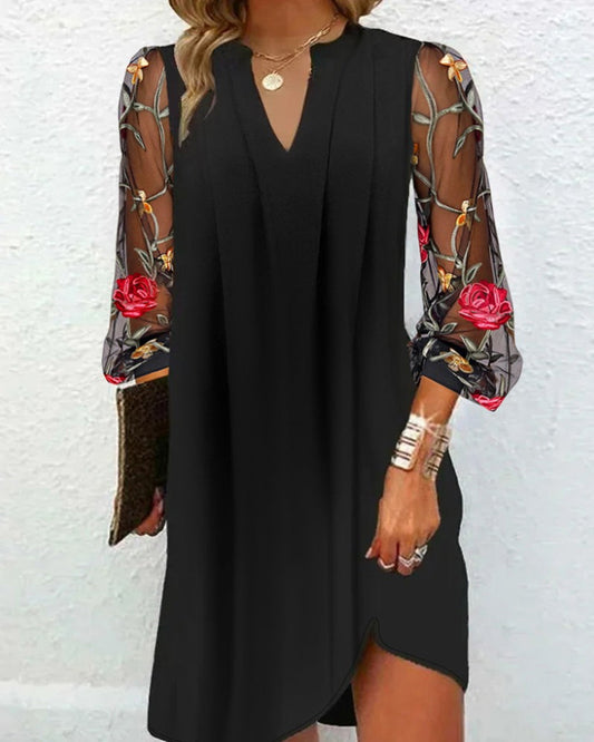 Dress with transparent sleeves and floral motifs